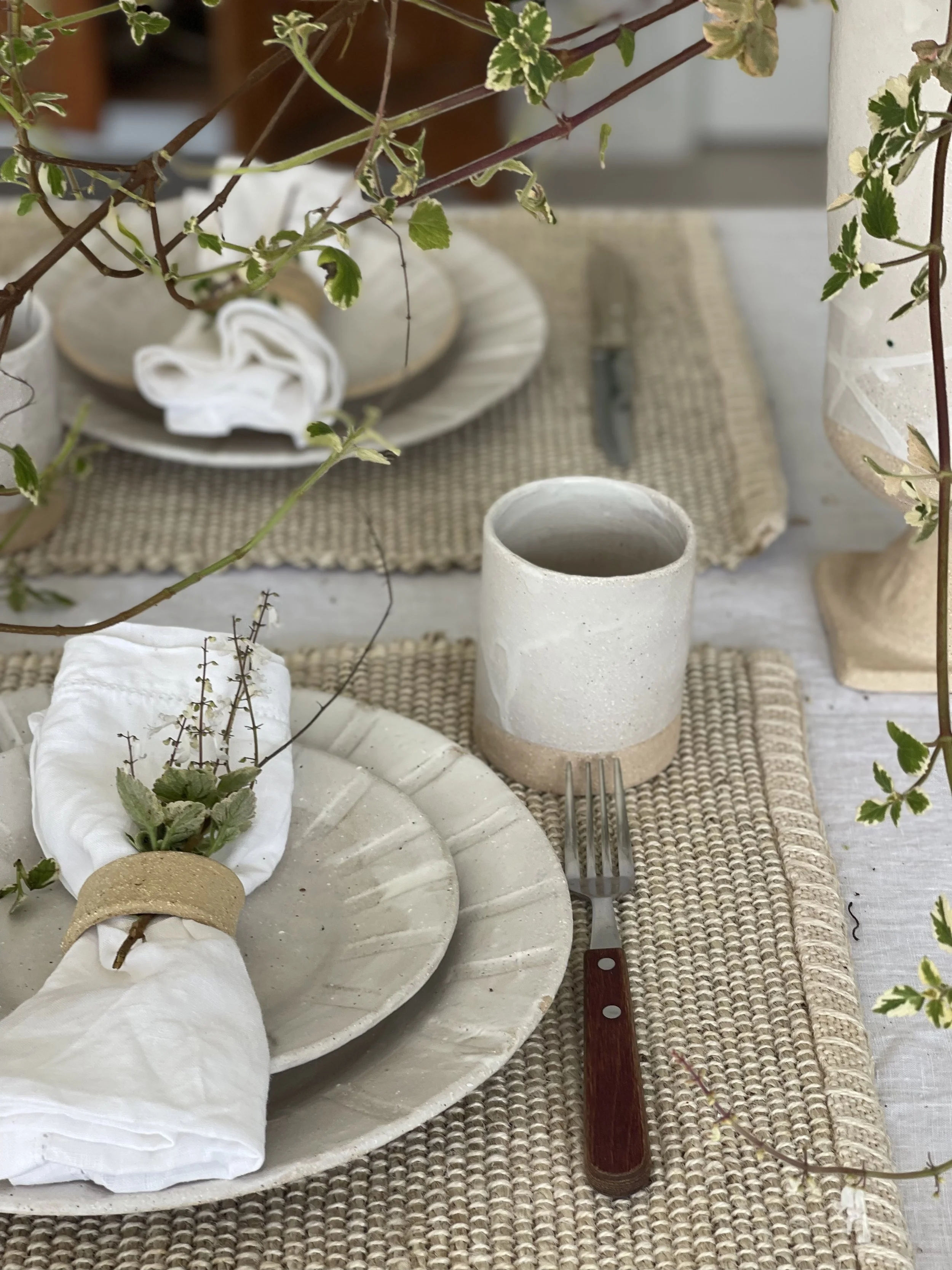 Handmade 250ml Hug Mug in Linen White matte glaze. Handleless design for warmth and comfort, crafted by Melissa Lellouche. Part of the artisan Linen White Collection.