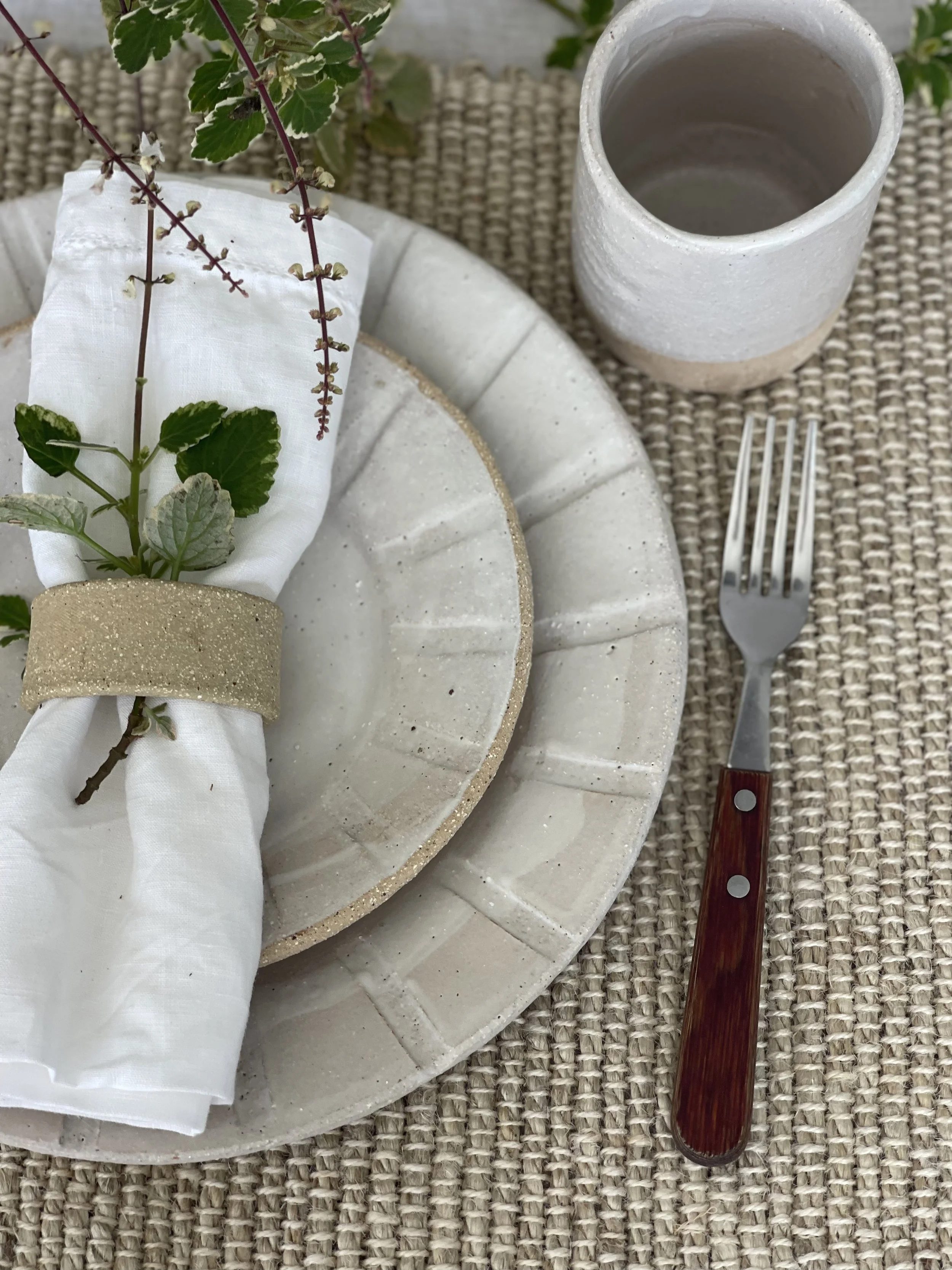 Handmade 250ml Hug Mug in Linen White matte glaze. Handleless design for warmth and comfort, crafted by Melissa Lellouche. Part of the artisan Linen White Collection.