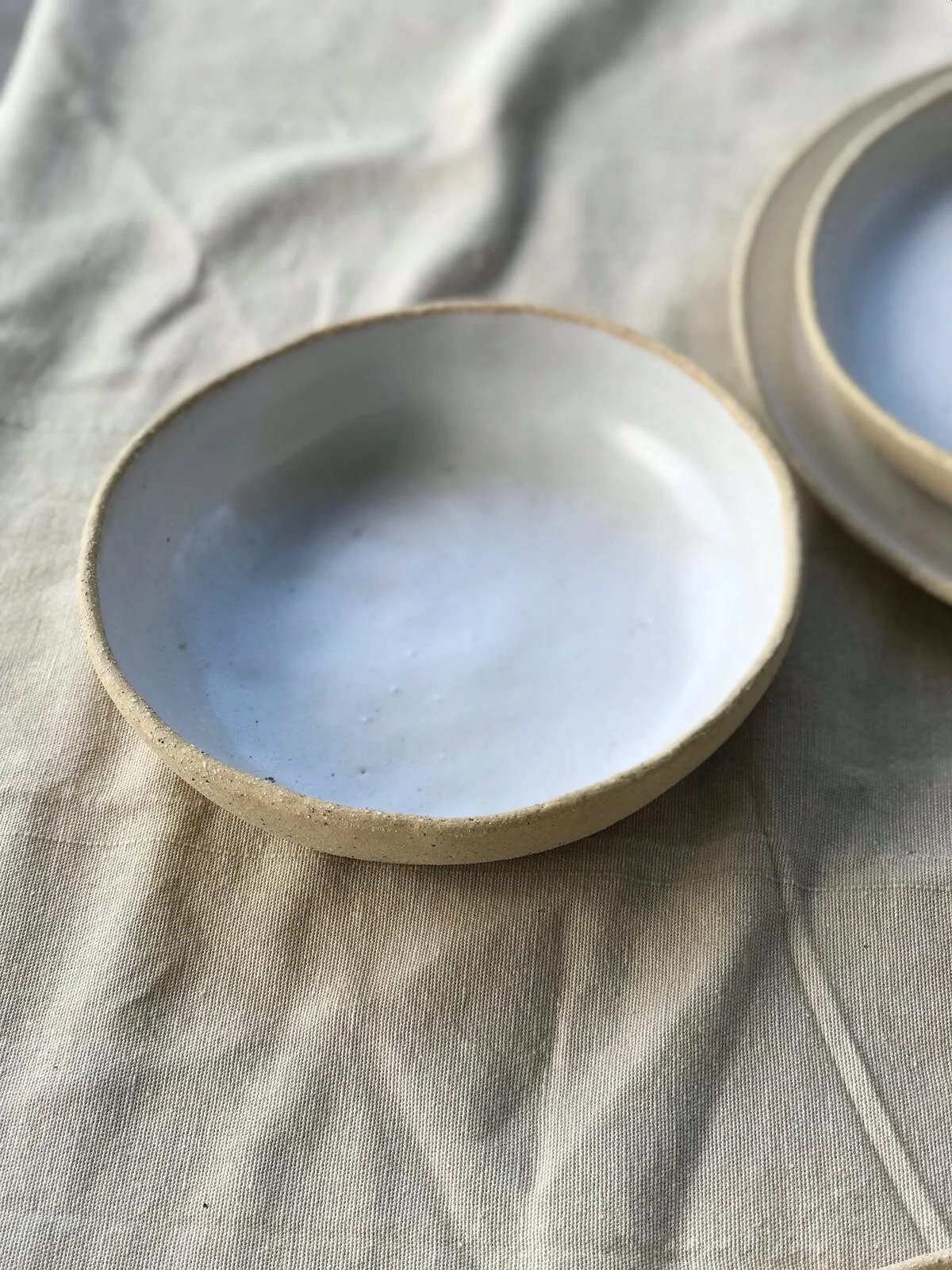 Linen White Breakfast Bowl – 17cm handmade ceramic by Melissa Lellouche with matte glaze.