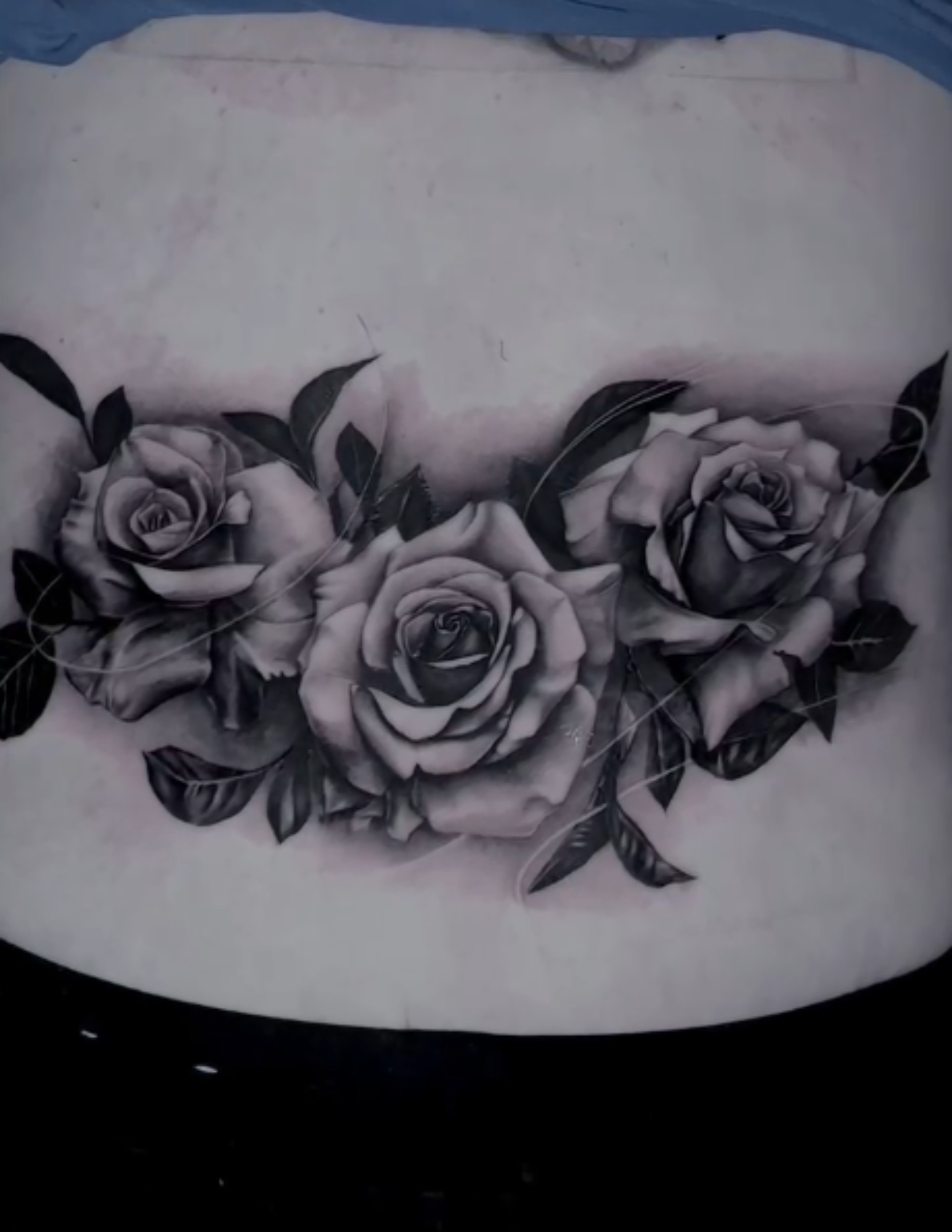 Realistic flowers tattoo on the back