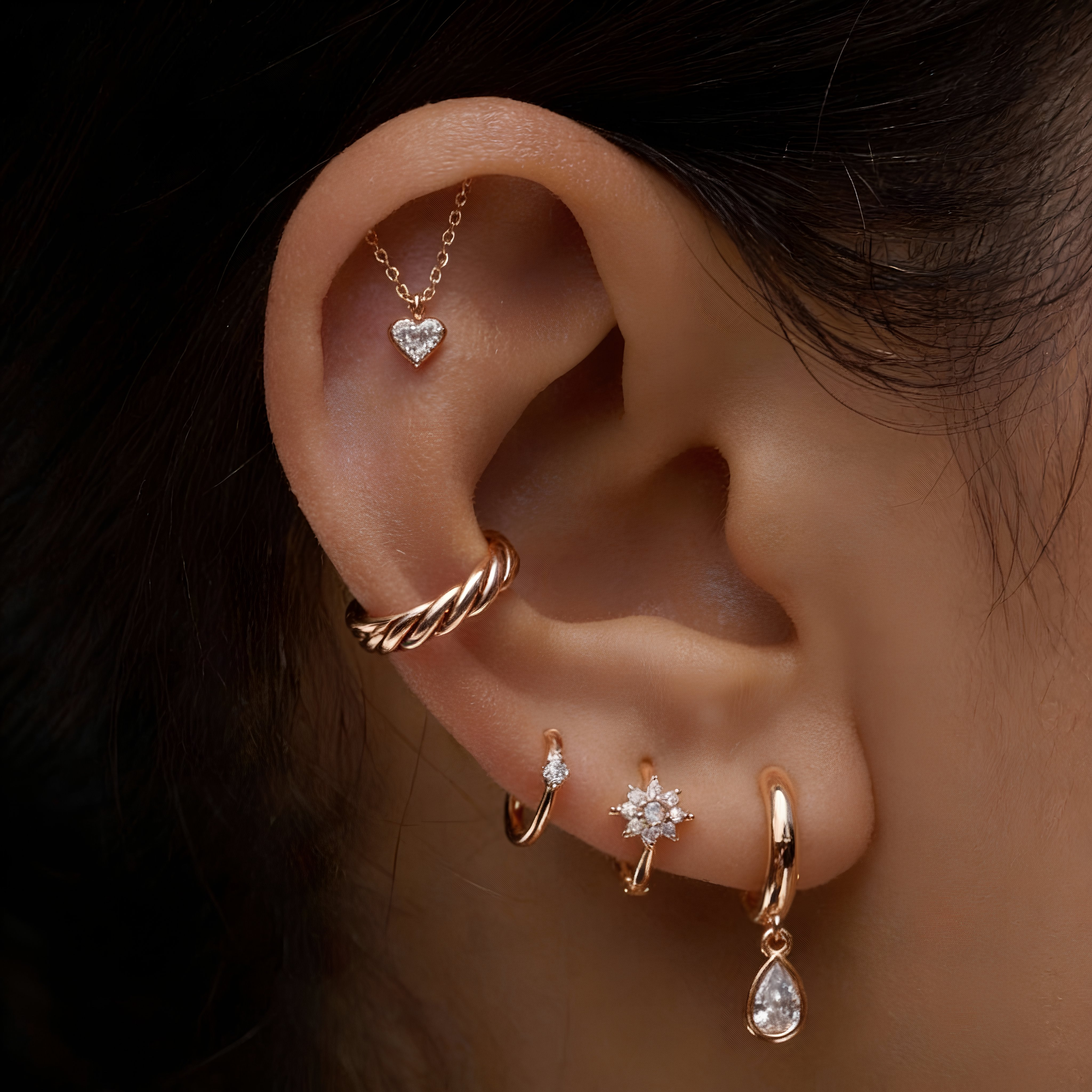 Luxury ear piercing with 14K gold jewelry at Salvation Beauty Ink