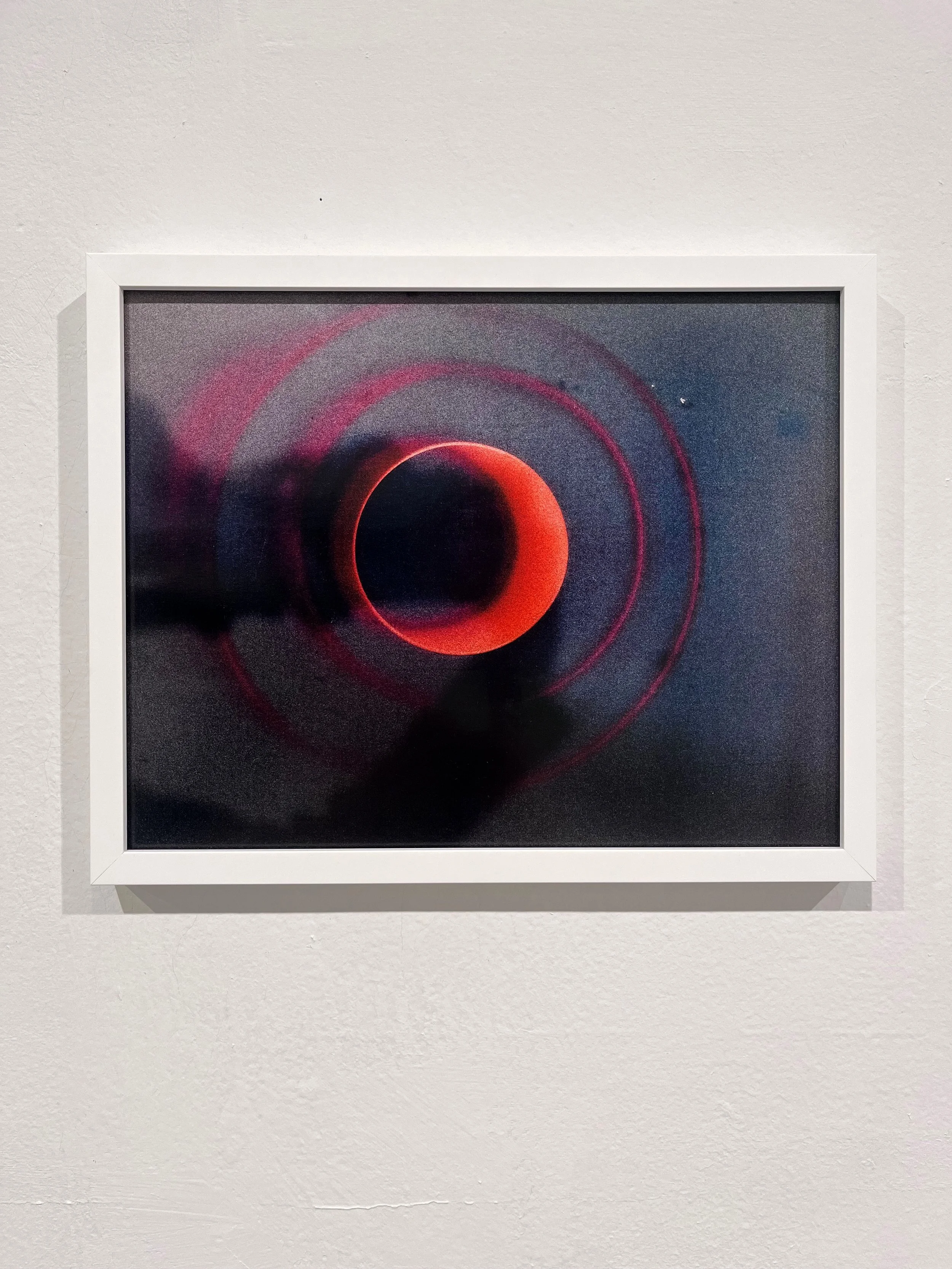 Exhibition view of Augie's Lunchbox (Red Planet), 11x14 inches, framed inkjet print of lumen print, UBS Bard Exhibition Center, NY, USA, 2025