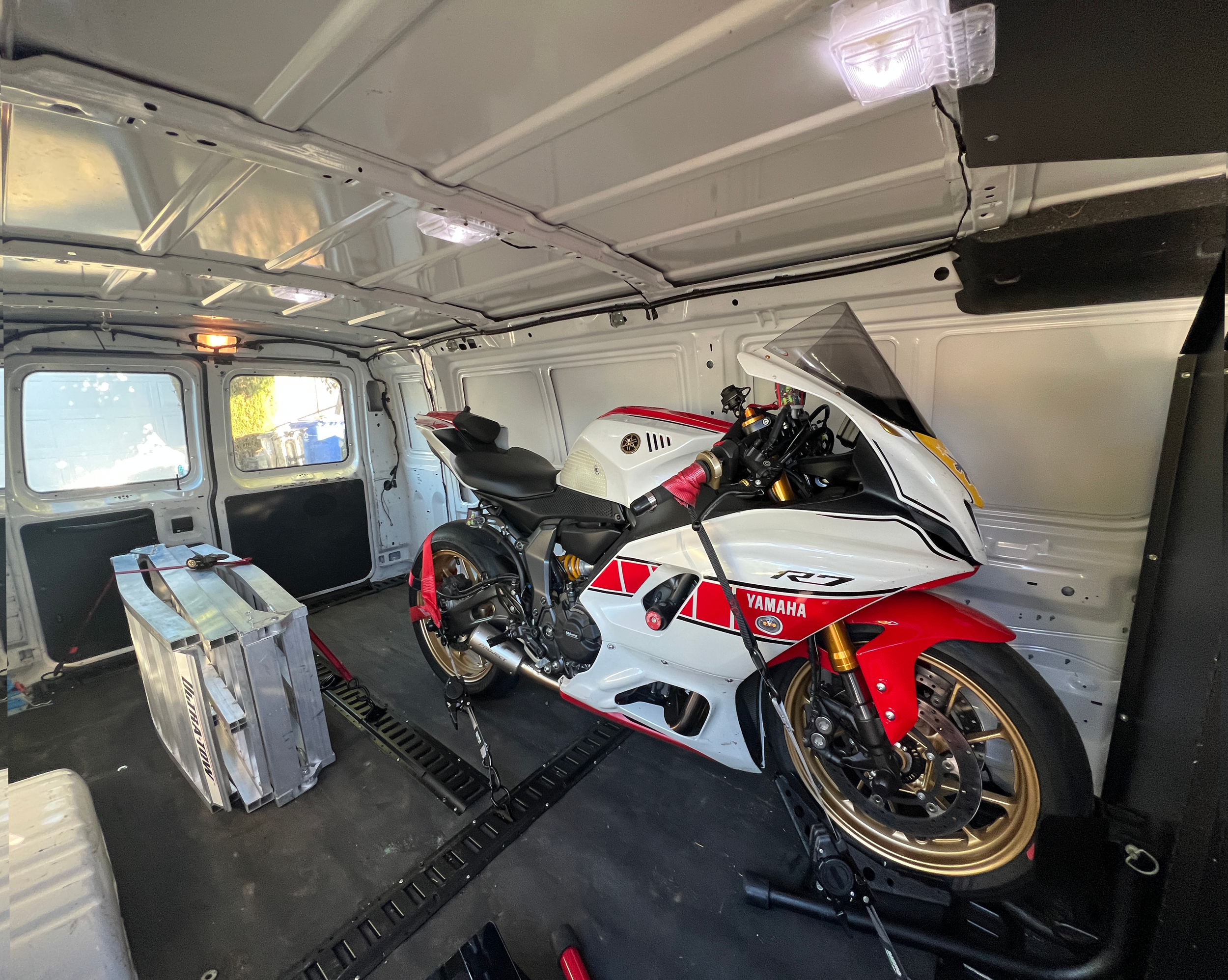 A new yamaha R9 loaded inside a cargo van on its way to a race track