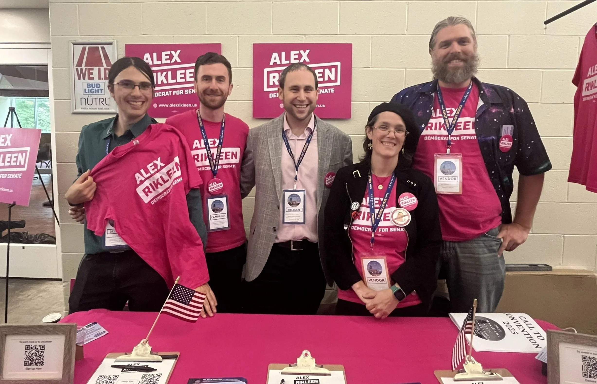 Alex with a group of volunteers at a campaign booth