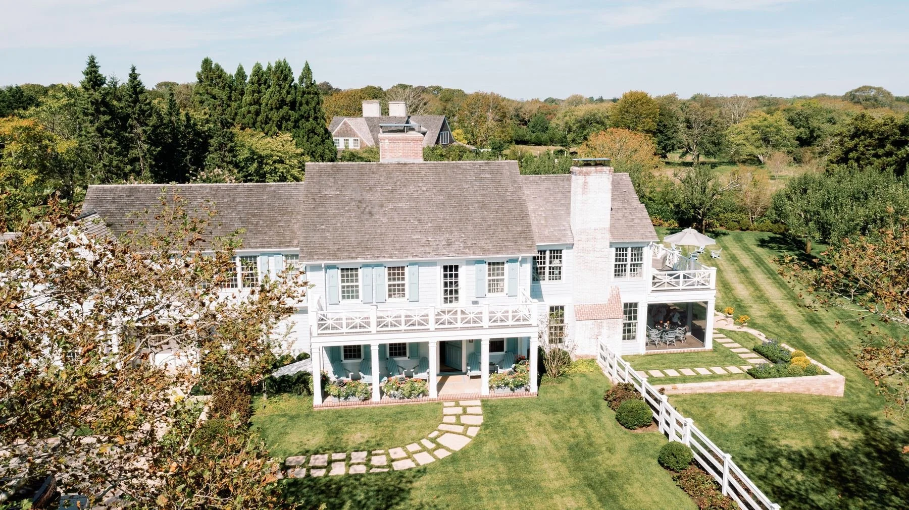 Shingled house and terraced lawn seen from above in East Hampton
