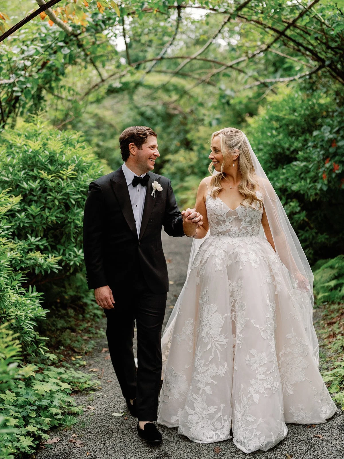longhouse-reserve-wedding-couple-laughing-garden-path-14.jpg