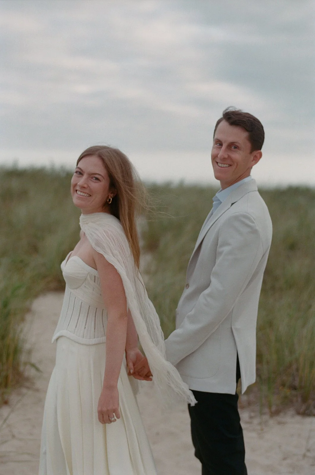 maidstone-club-wedding-venue-couple-on-dune-path-01.jpg