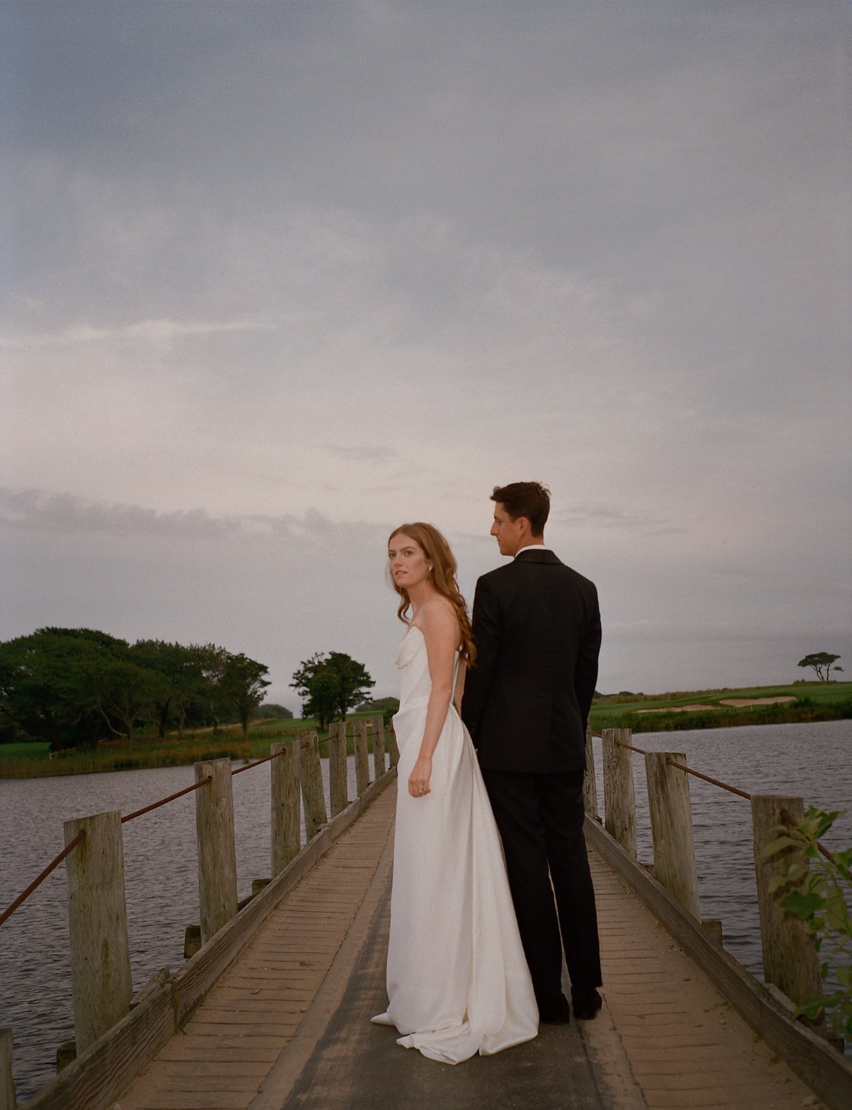maidstone-club-wedding-venue-couple-footbridge-dusk-11.jpg