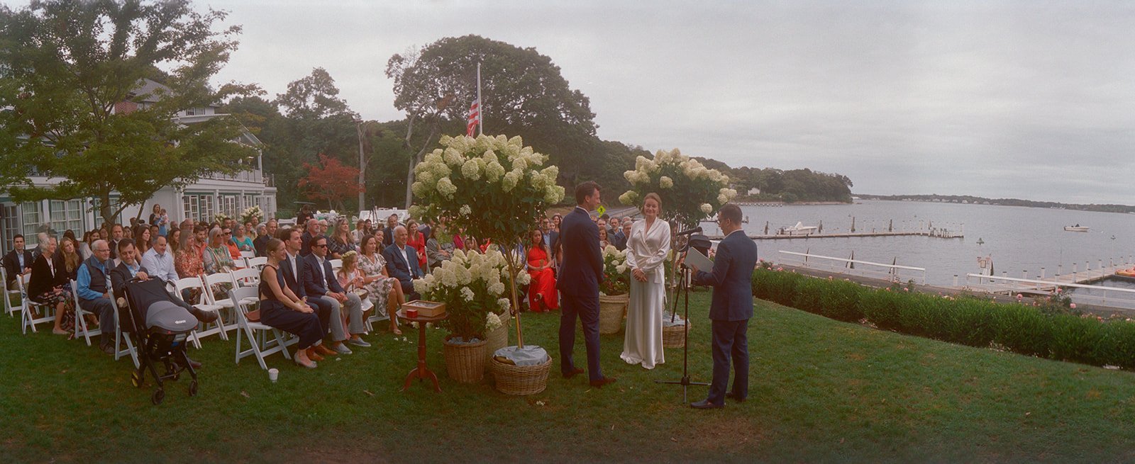 Wide view of the lawn ceremony at The Pridwin Hotel with guests facing the water