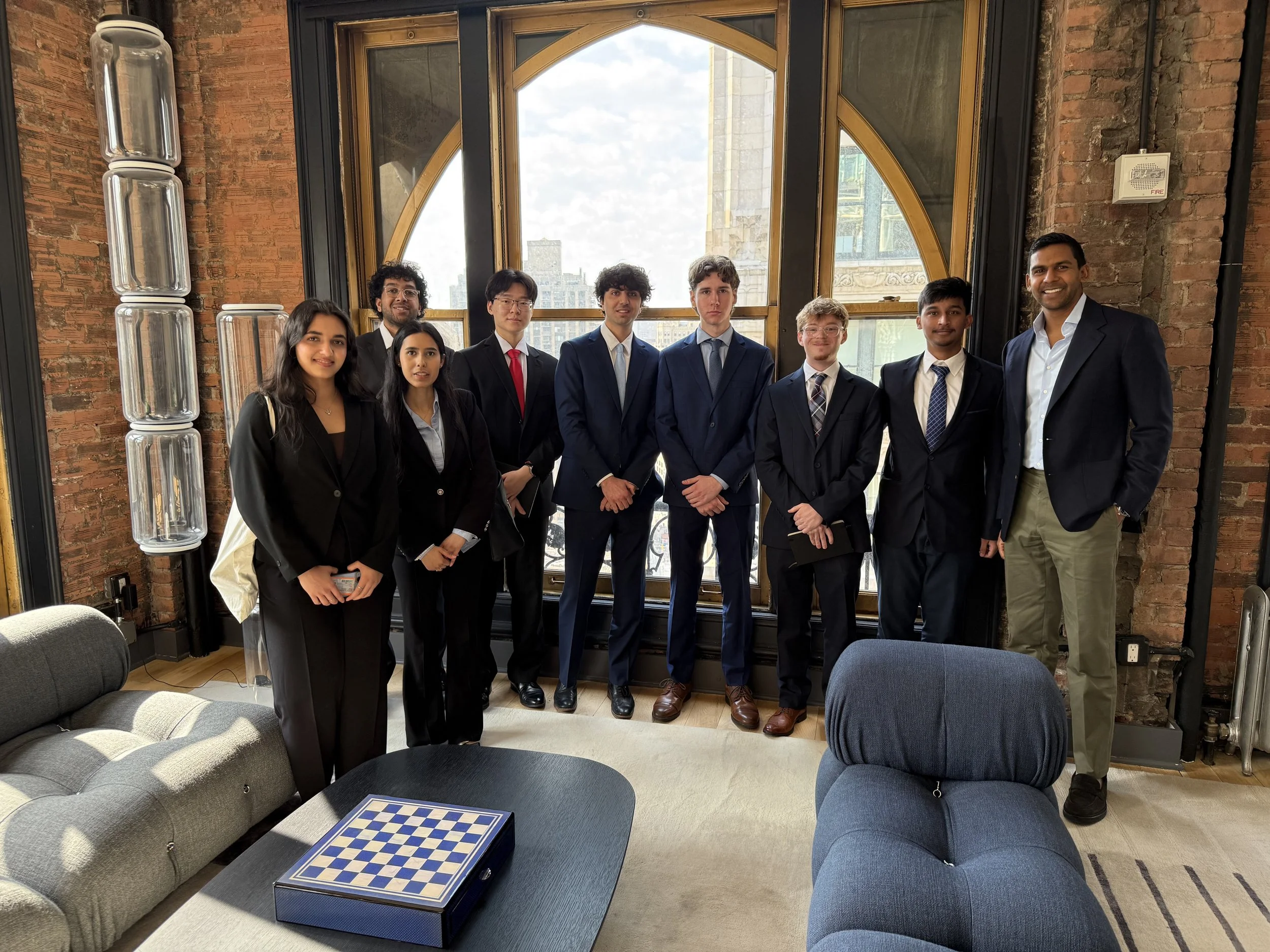 Group_at_Loft_Office_with_NYC_Skyline_Arched_Windows.jpg