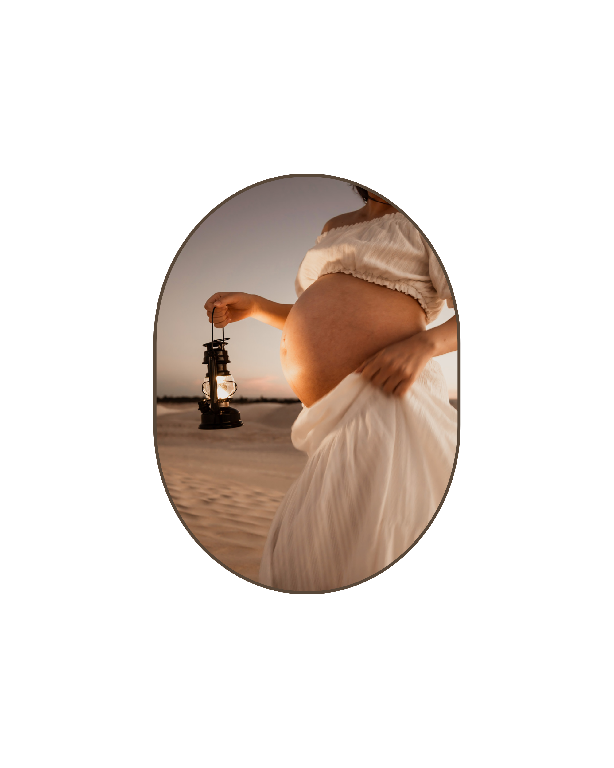 Pregnant woman in a white dress holding a lantern on a sandy landscape during sunset. Unique maternity photoshoot in Lancelin sand dunes, Perth WA.
