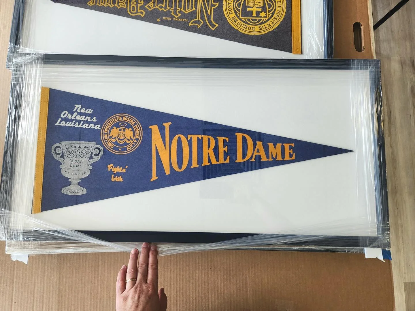 This pennant flag was taken off the sidelines and given the spotlight it deserves &mdash; framed and ready to fight for old Notre Dame ☘️📣

#theframeshop #theframeshopsouthbend #southbendframing #framing #customframing #michianaframer #framed #artfr
