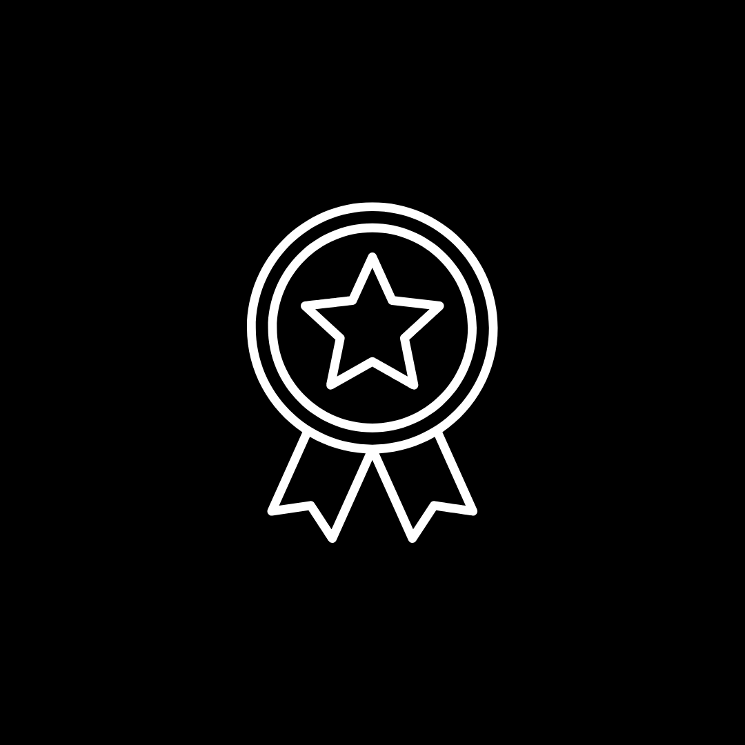 Icon of a medal with a star in the center and two ribbons hanging below.
