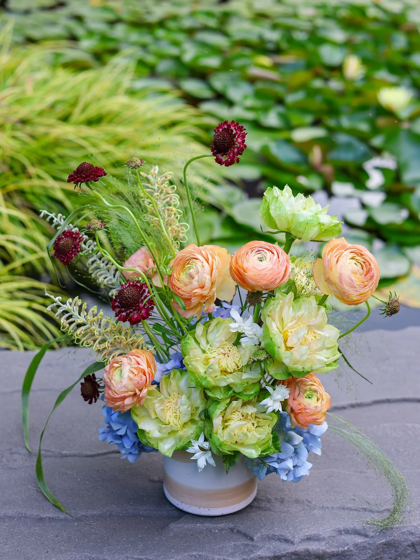 Cutie patootie from this summer, the veggie roses looking just edible! Hydrangeas from our own plant before they turned pink lol 🥬🫐🍊🌹

#floralarrangement #michiganflorist #eventflorist #detroitflorist #flowers