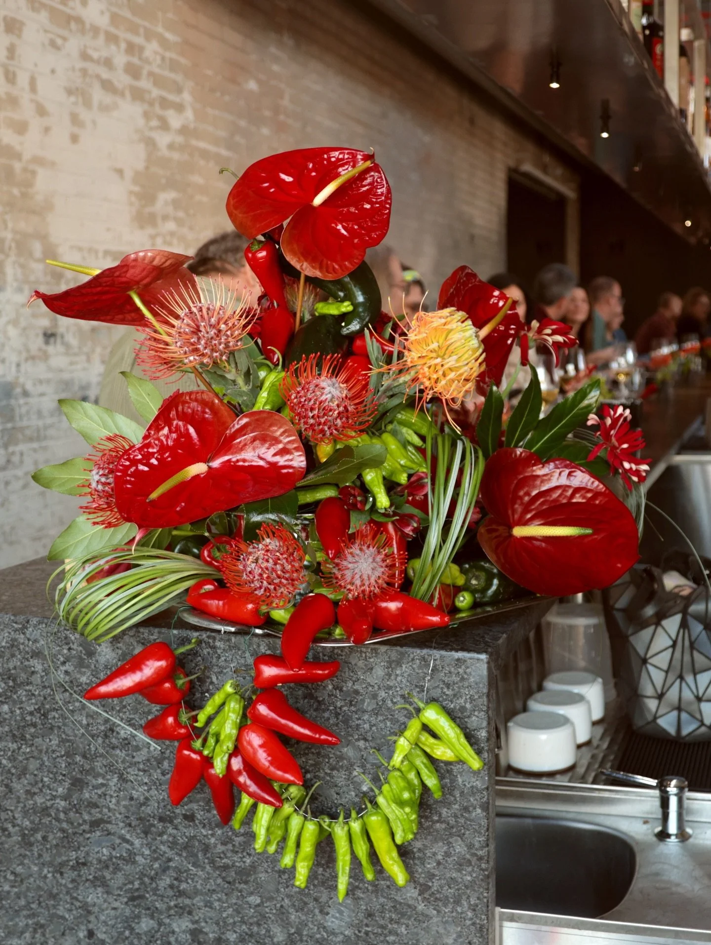 Fiery fun pepper sculptures for @wdetdetroit Essential Cooking dinner with @anndelisi at @puma_detroit 🔥

These floral arrangements were crafted to be as delicious as the night&rsquo;s dinner! Each piece paid homage to the menu, using shishito peppe