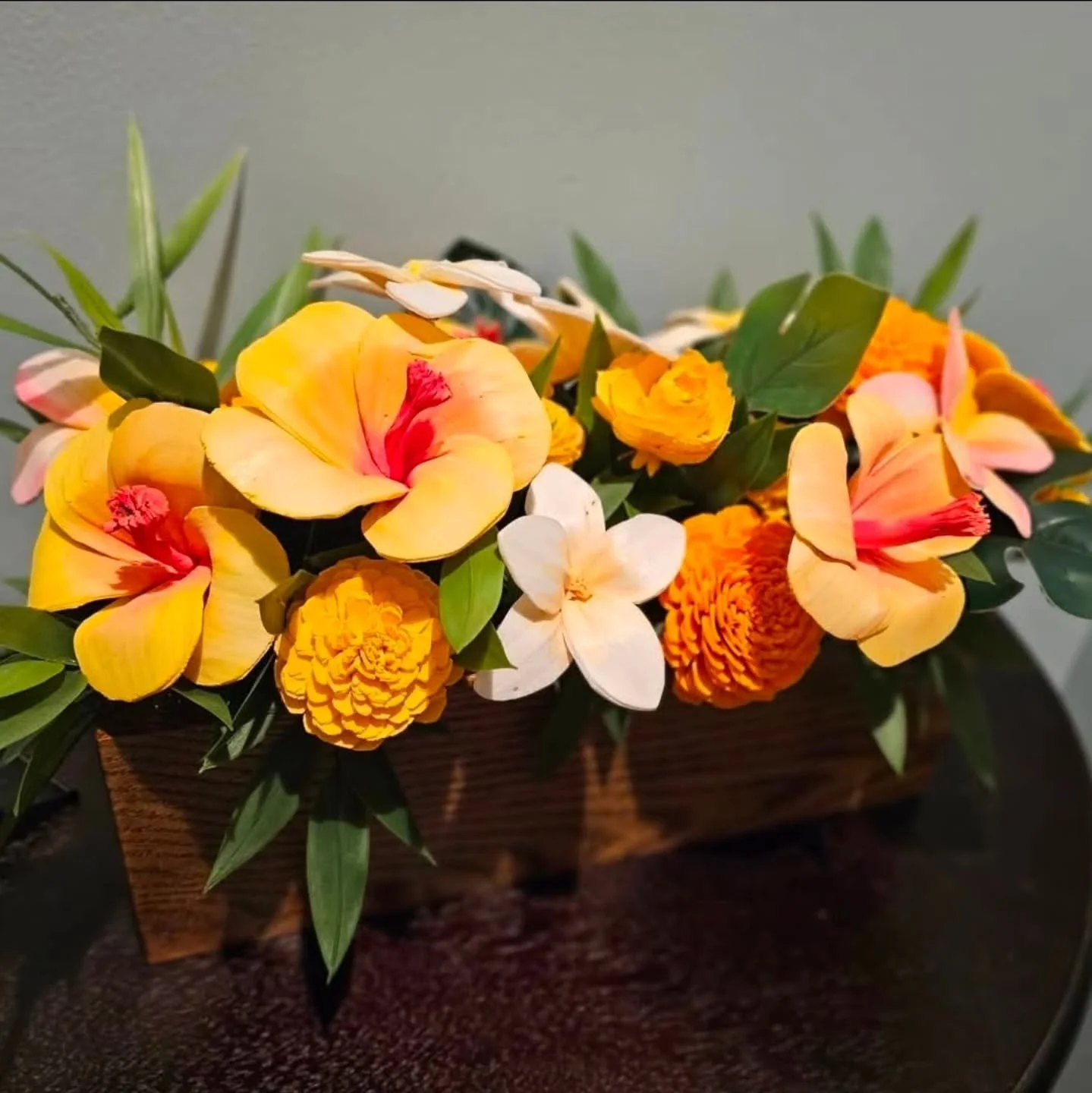 A 12 inch wooden box handmade by my husband and filled with beautiful handpainted tropical inspired wood flowers. 🥰