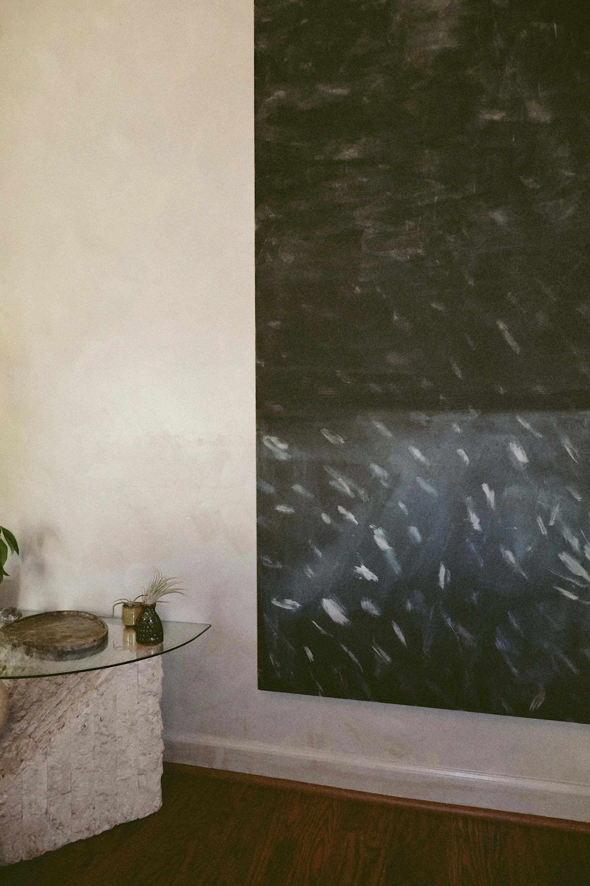 large scale artwork by Taylor Robinson of VISCERAL HOME hanging in a modern living room in Charleston SC