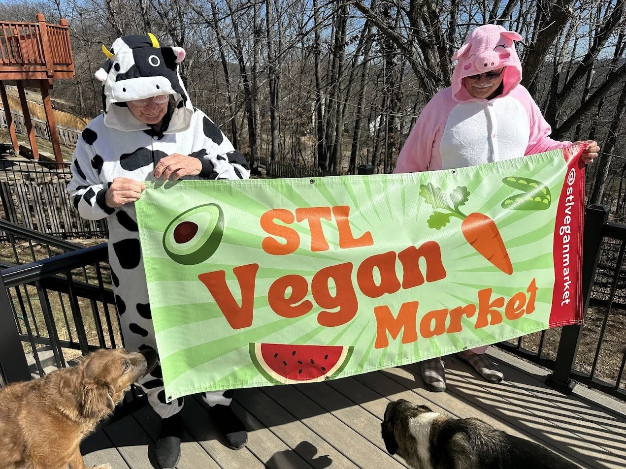 John Luzynski and Al holding our STL Vegan Market banner