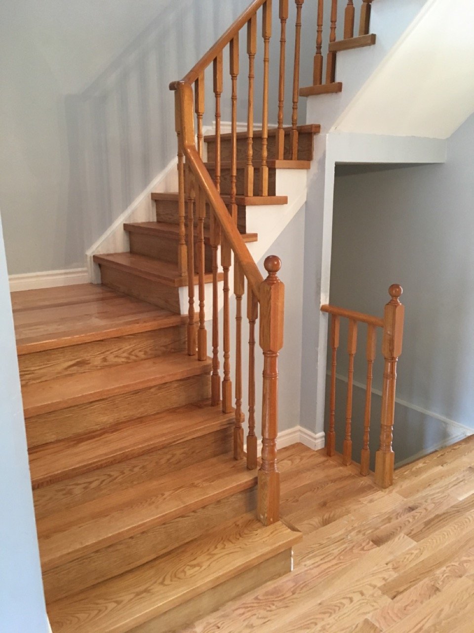 Wooden staircase with railing in a home interior