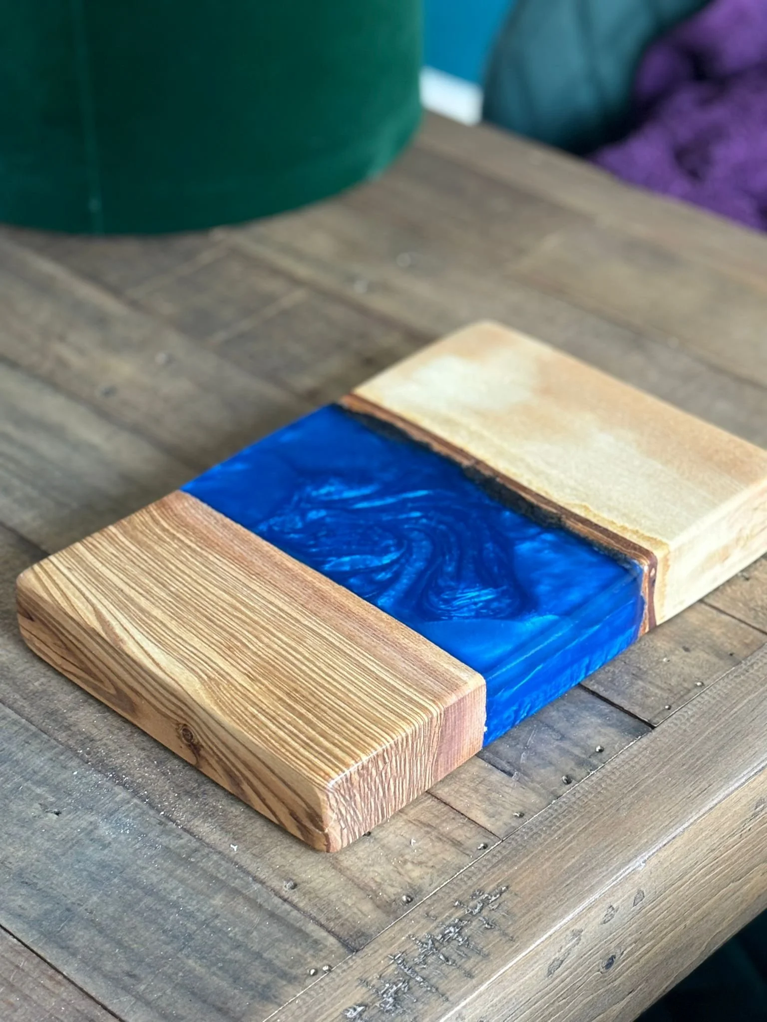 Wood and resin cutting board with blue epoxy