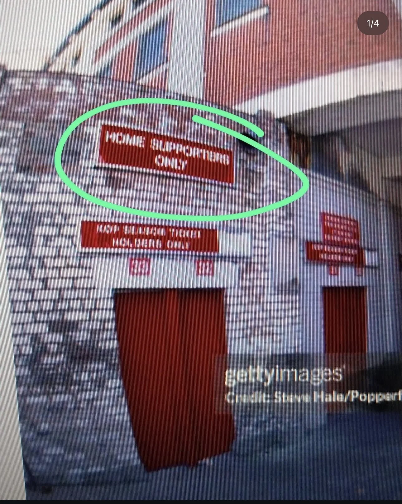 Exterior of a building with multiple red signs. The prominent sign reads 'MORE SUPERVISING ONLY' and is circled in green. Other signs indicate 'EMP BEARING TICKET HOLDERS ONLY' with instructions. The building has brick walls and there are multiple do