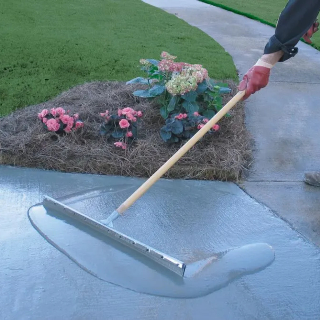 Worker resurfacing residential concrete