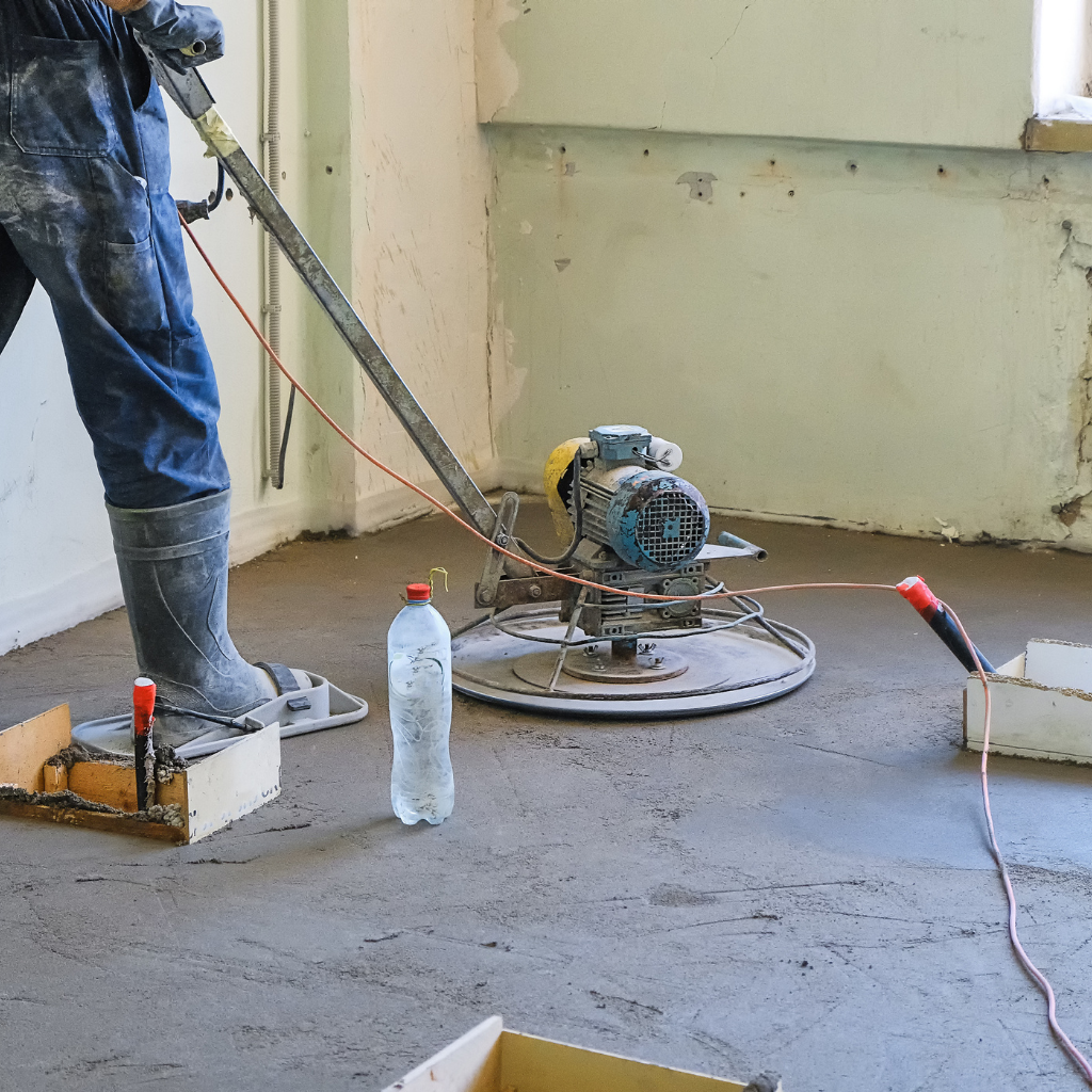 Aurum Concrete worker grinding interior concrete