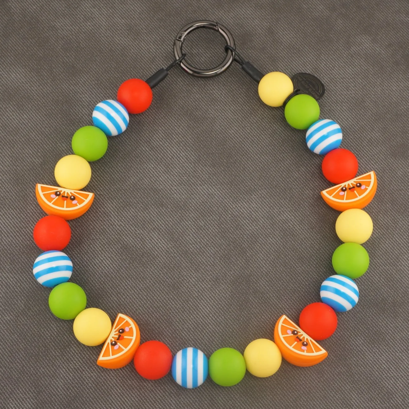 Main Squeeze - Stylish beaded dog collars and necklaces with orange slice accents, blue strips, green, yellow, and red.