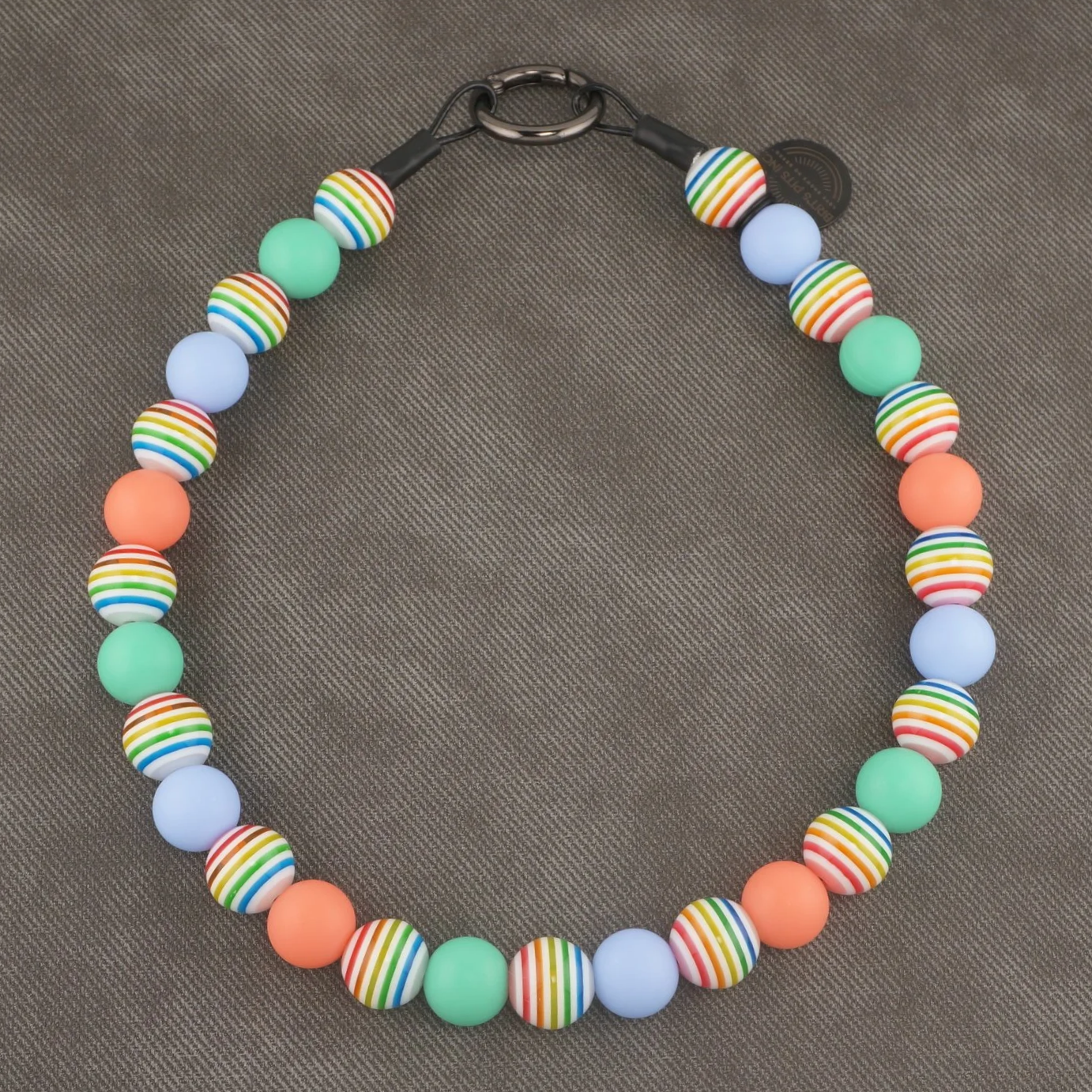 Sandy Paws Social Club - Stylish beaded dog collars and necklaces with teal, light blue, pink, and rainbow stripes.