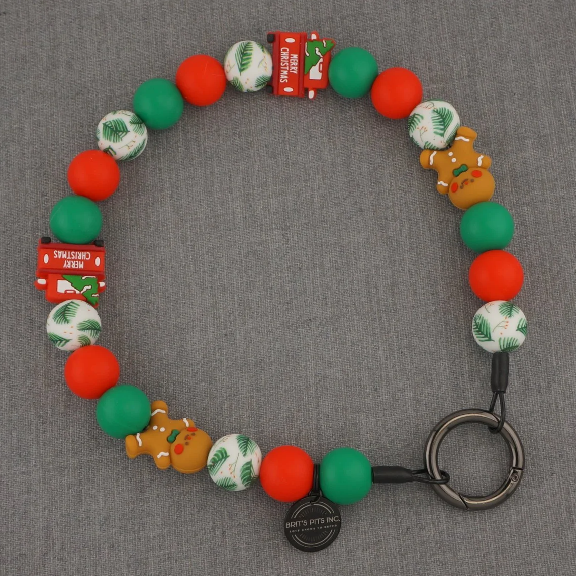 Christmas themed decorative dog collars and necklaces with trucks and gingerbread men.