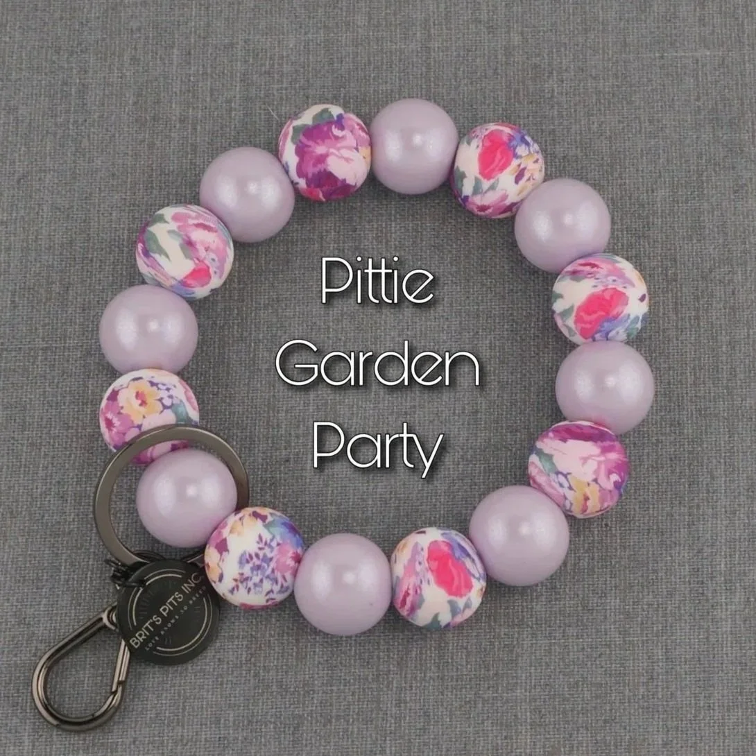 Pittie Garden Party. Beautiful floral wristlet keychain made with silicon beads. Match your dogs decorative dog collar or necklace.