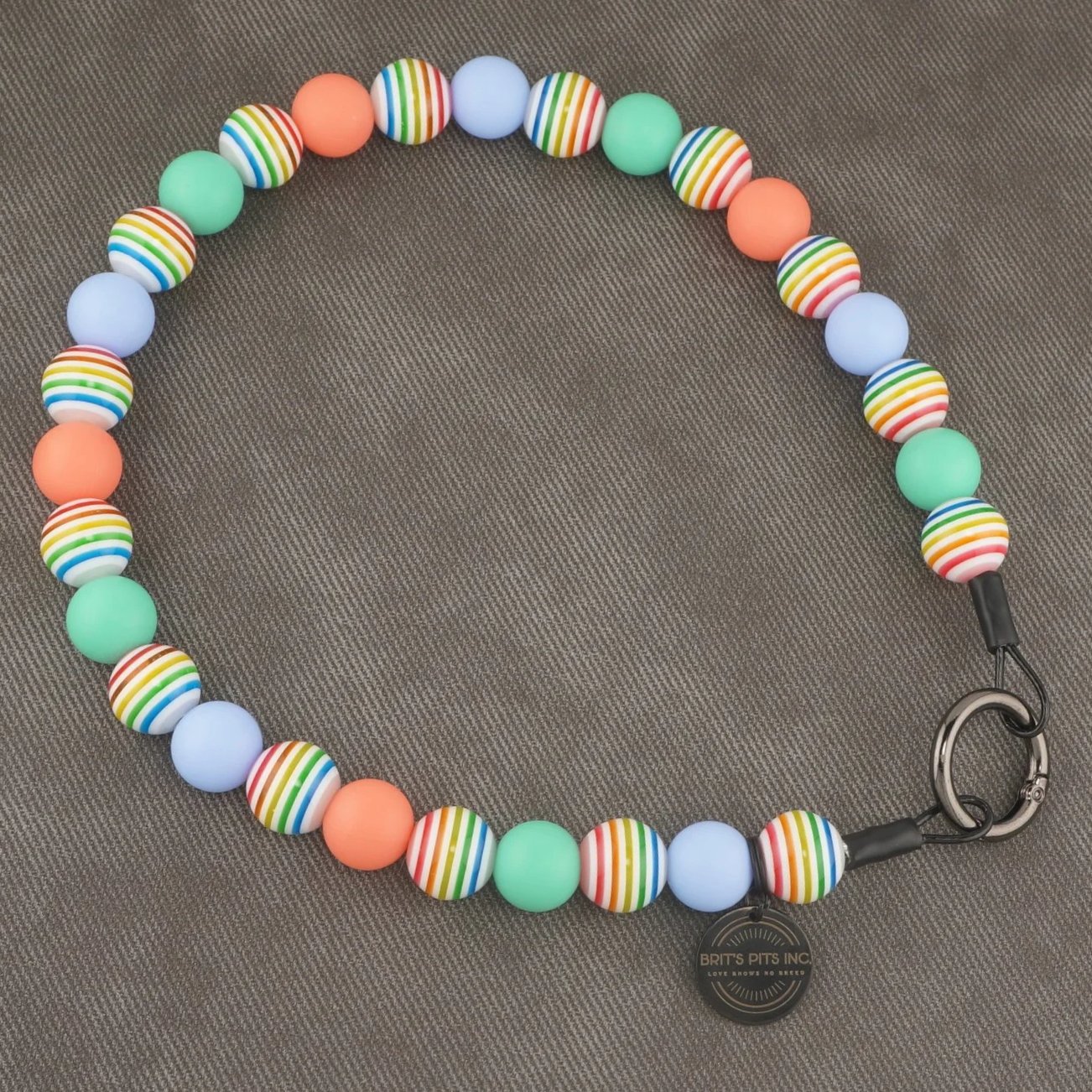 Sandy Paws Social Club - Stylish beaded dog collars and necklaces with teal, light blue, pink, and rainbow stripes.
