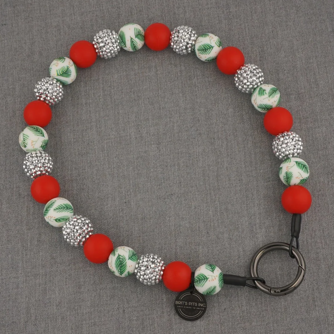 Christmas holiday themed decorative dog collars and necklaces with red, mistletoe, and silver rhinestones that sparkle.