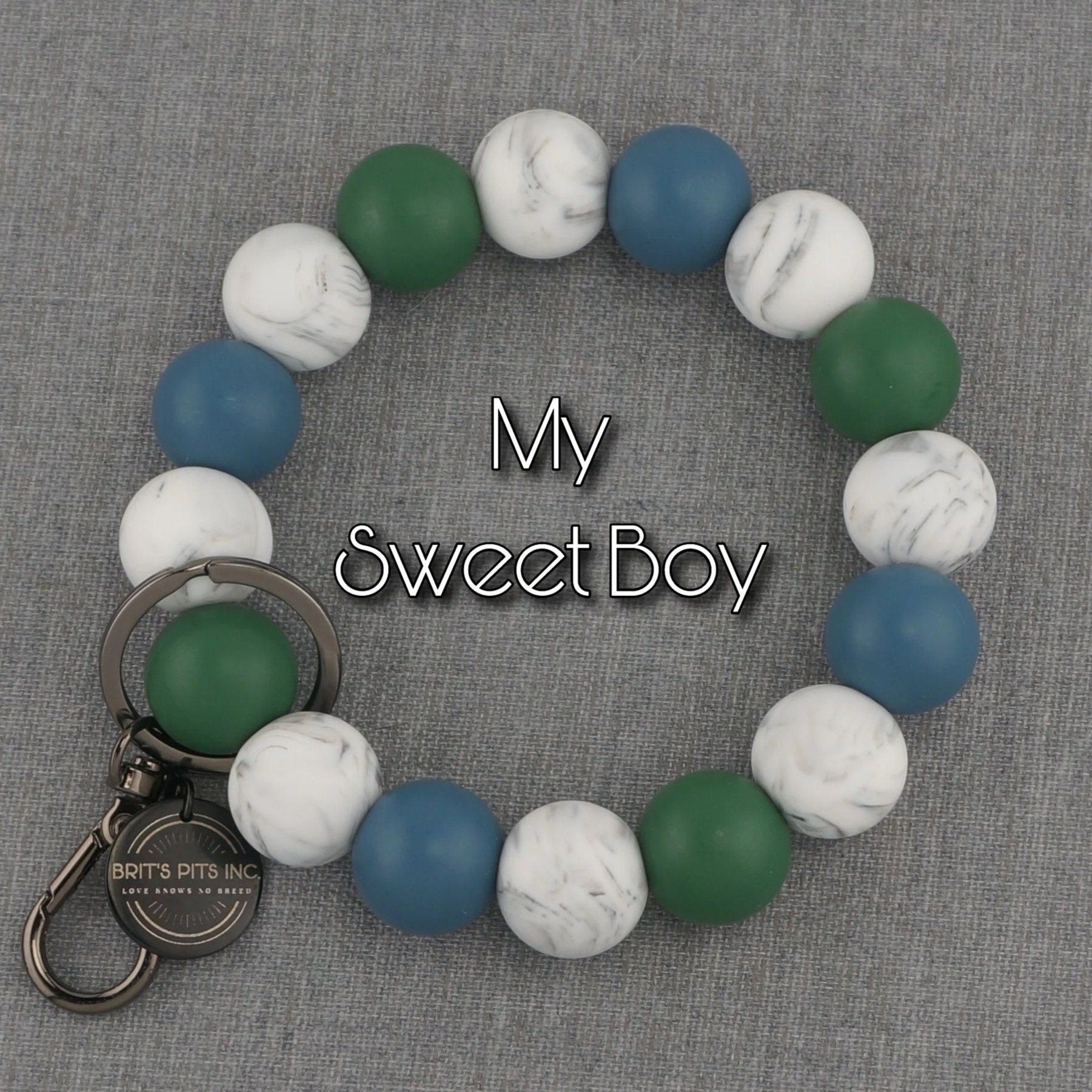 My Sweet Boy. Silicone beaded wristlet keychain in dark blue and green with marble accents.