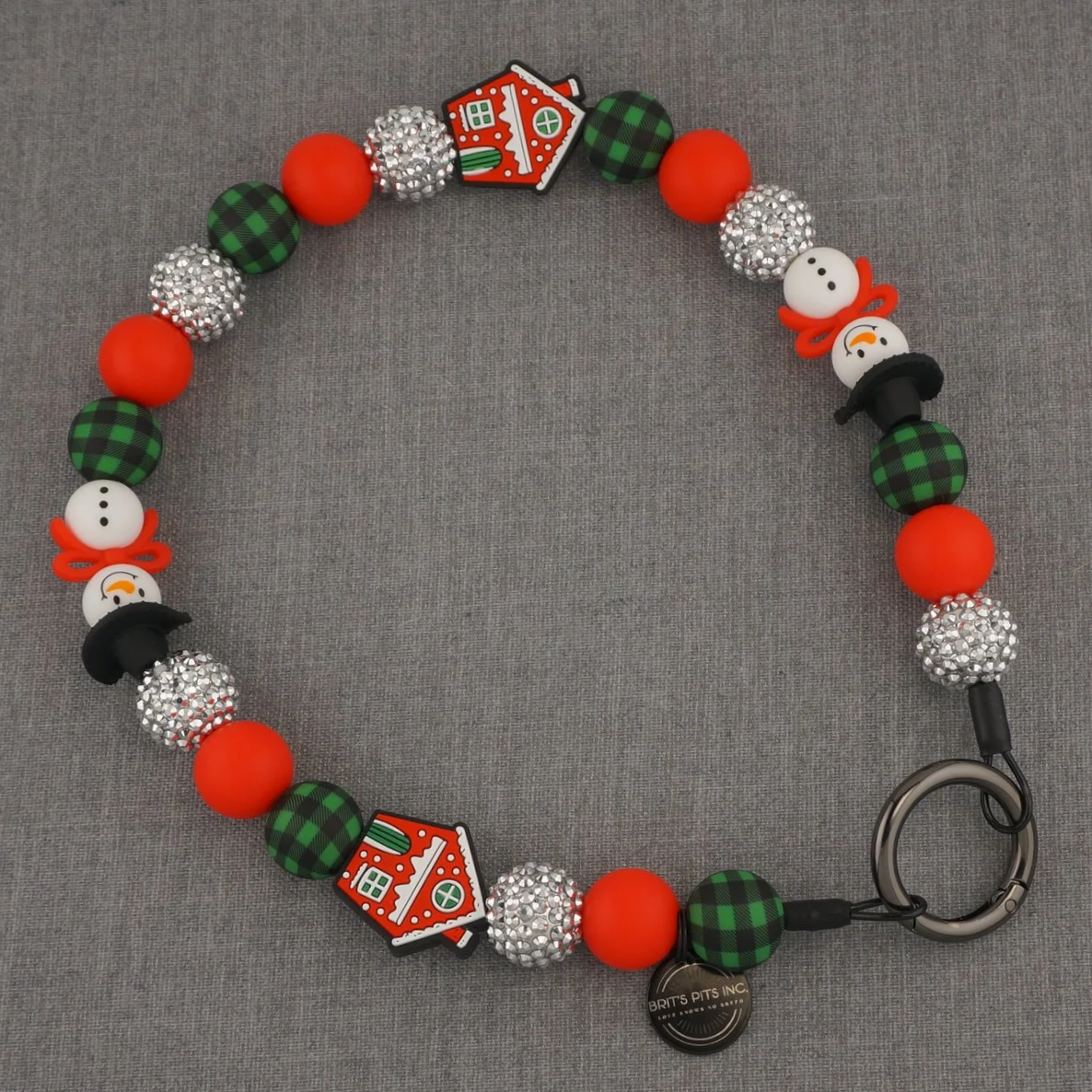 Decorative Christmas themed dog collar or necklace with snowmen and gingerbread houses.