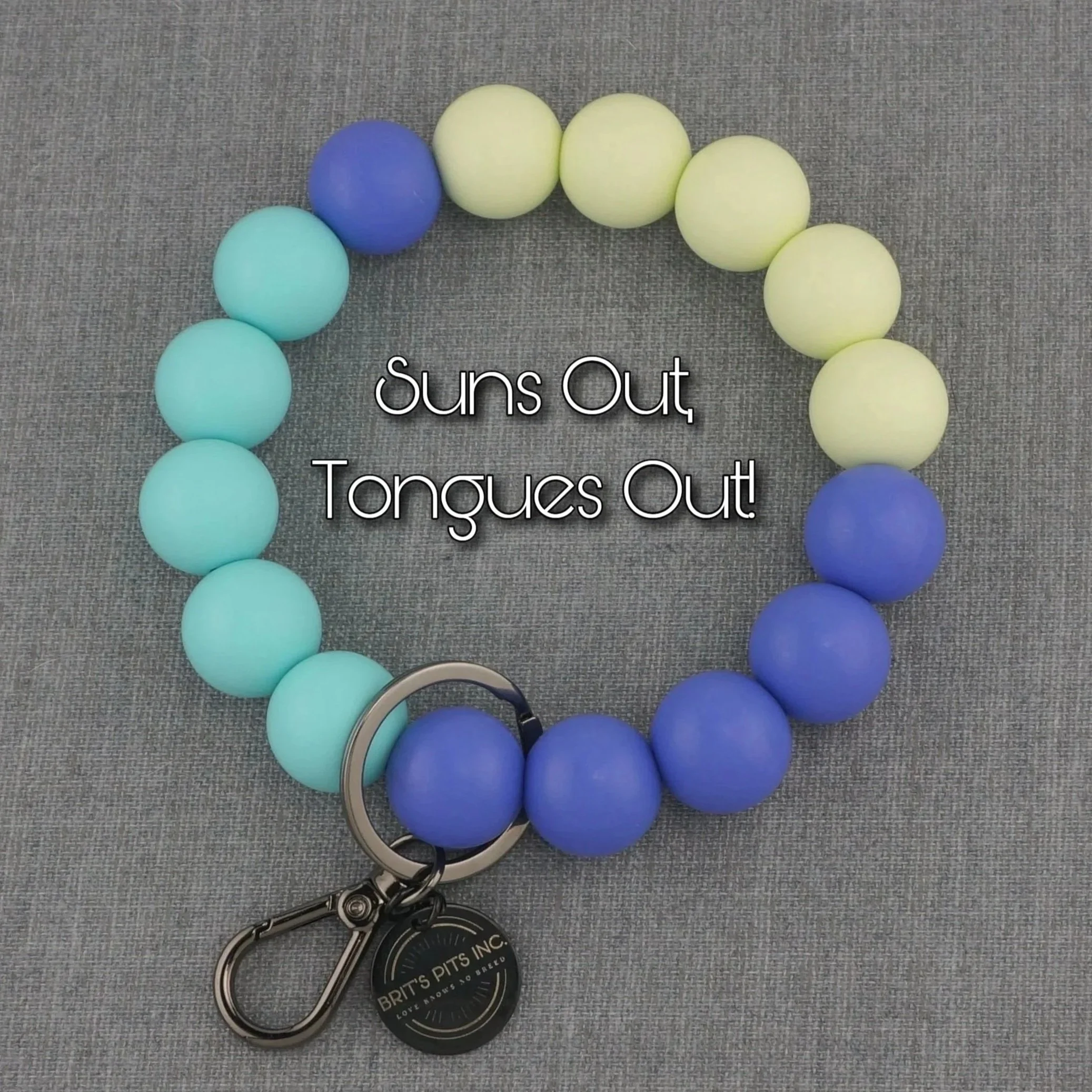 Suns Out, Tongues Out! Beaded wristlet keychain to match your dog's decorative collar or necklace in bright spring colors. Purple, light blue, yellow.