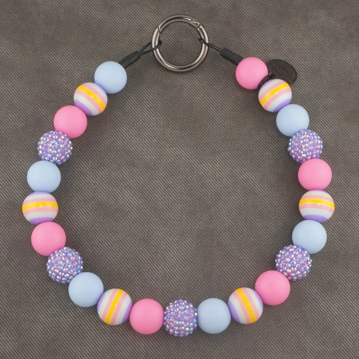 Stylish beaded dog collars and necklaces with pastel vibes, stripes, and rhinestones.