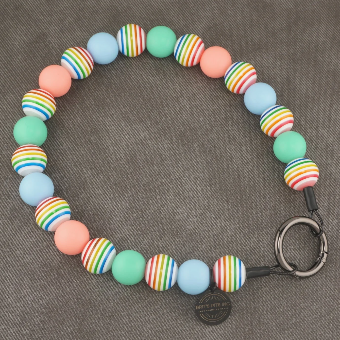 Sandy Paws Social Club - Stylish beaded dog collars and necklaces with teal, light blue, pink, and rainbow stripes.
