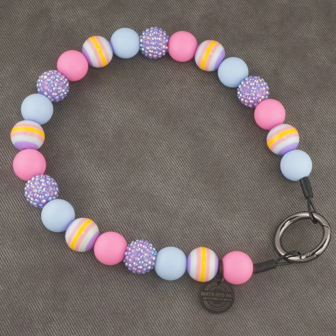 Stylish beaded dog collars and necklaces with pastel vibes, stripes, and rhinestones.