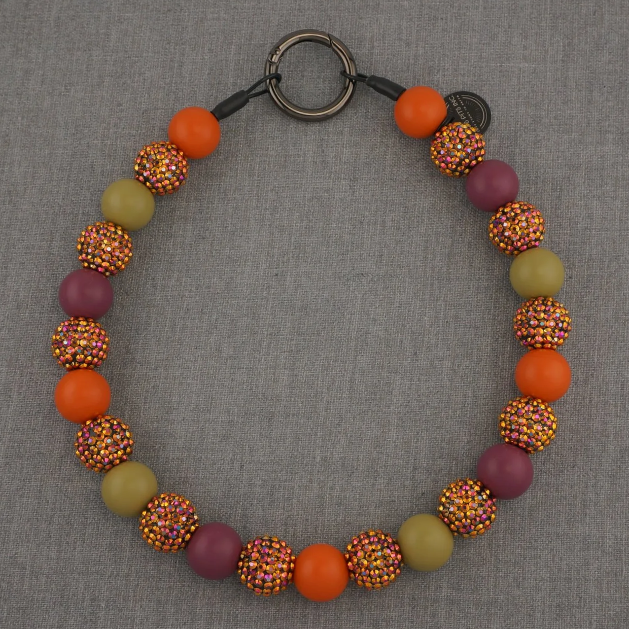 Fall inspired decorative dog collars and necklaces with orange, purple, green, and multicolored rhinestones.