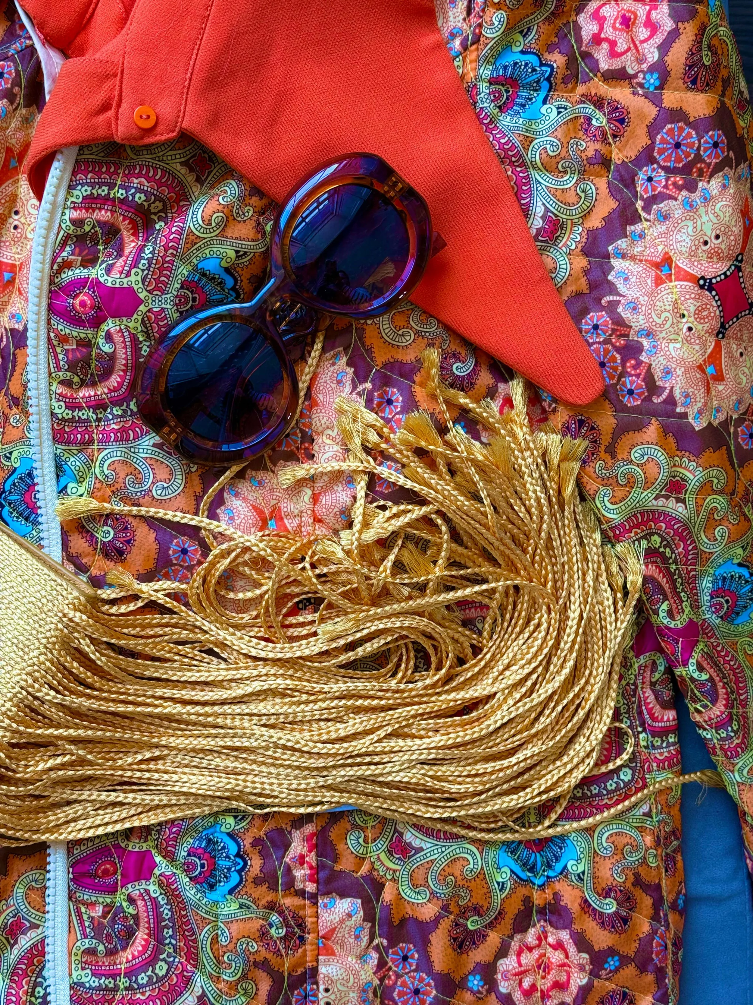 a selection of samantha's wardrobe accesories (sunglasses, fringed bag, paisley jacket)