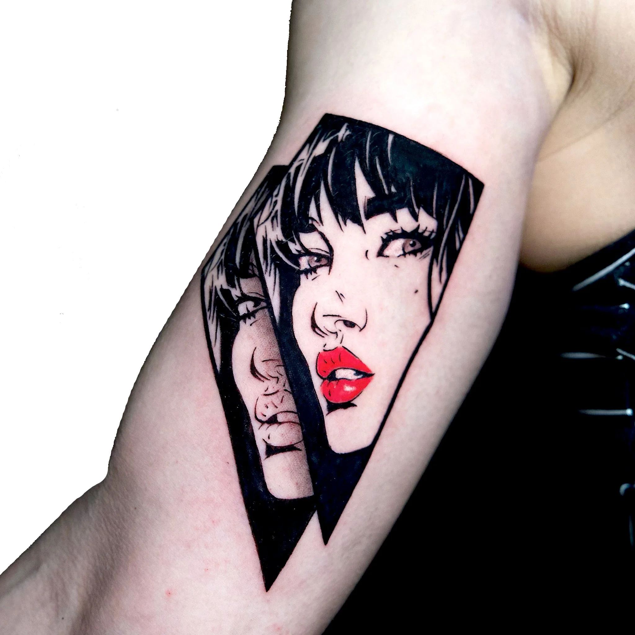Tattoo of two women's faces within a black triangular frame, one with red lipstick and black hair, the other with a neutral expression and light-colored hair.