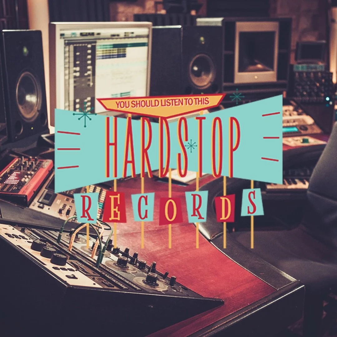 A music studio with electronic equipment, computers, and audio speakers; overlay with colorful retro-style text that says "You should listen to this Hardstop Records."