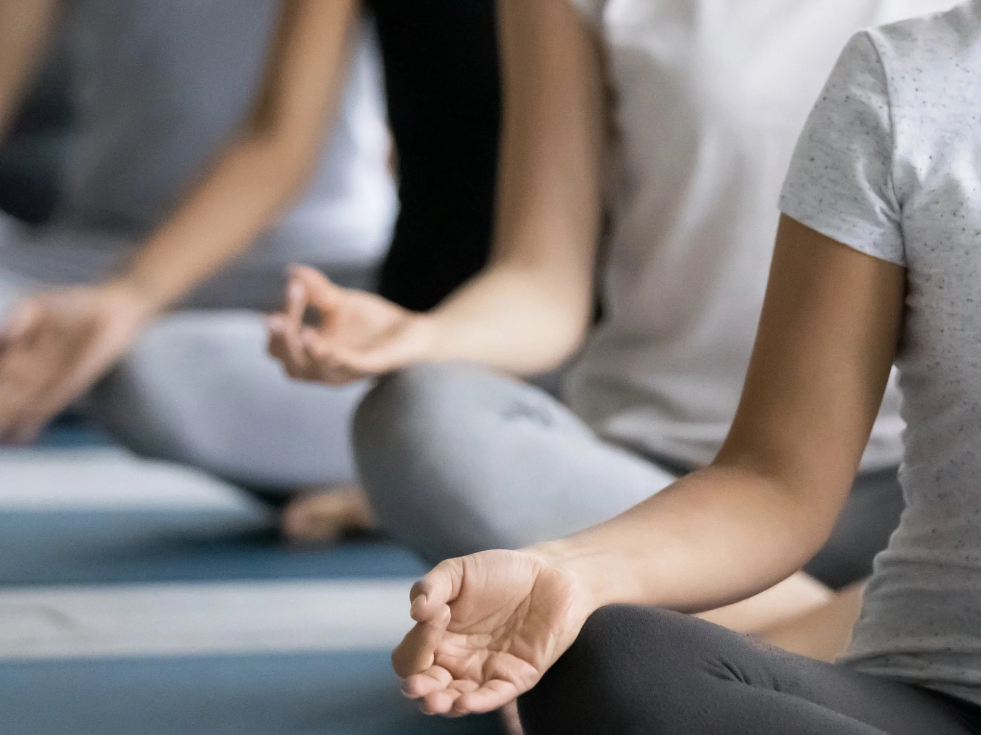 Group yoga class in session, participants stretching with arms raised, at Everybody Yoga & Wellness studio. Text reads: 'Freestyle Yoga Flow, Saturdays 9-10AM, 1245 Horseshoe Pike, Downingtown, PA 19335. Book Now!'