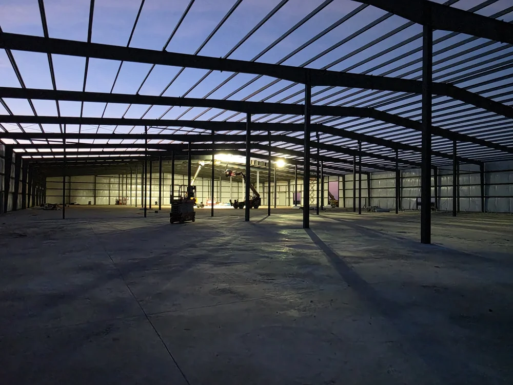 Rigid frames and purlins over the slab of a data center staging and laydown building