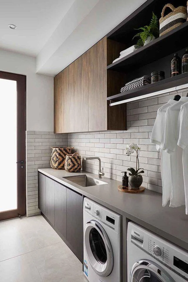 Dark timber laundry renovation with tiled splashback and open shelving