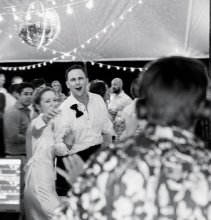 Crowd dancing at a wedding reception silent disco in San Diego