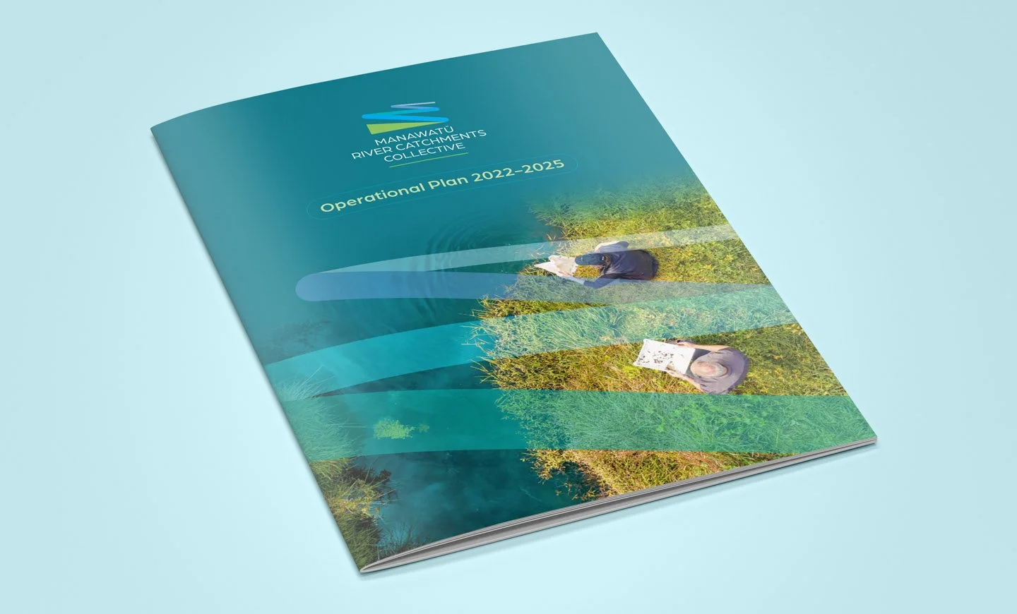 Cover page of the Manawatū River Catchments Collective operational plan 2022-2025, featuring an image of two people outdoors, one holding a map, in a natural setting with trees and bushes.