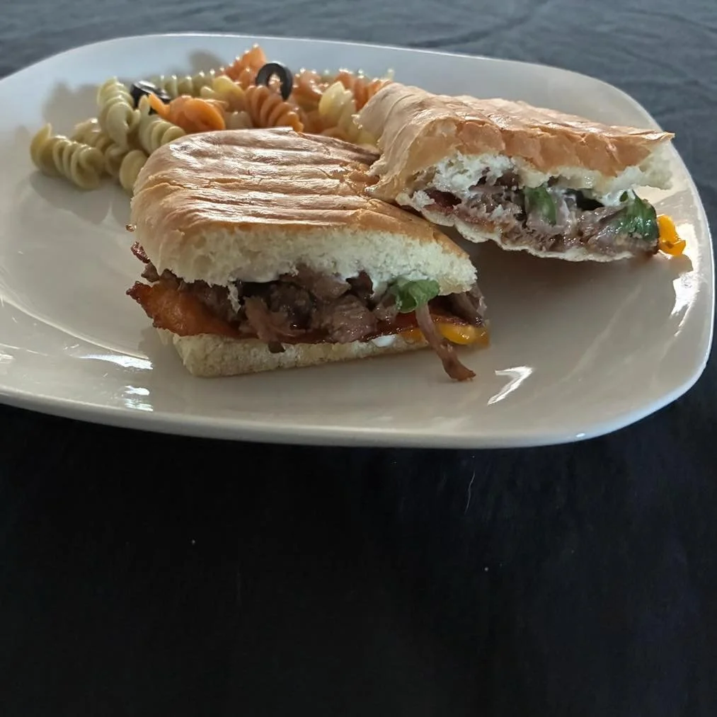 🥪✨ Today&rsquo;s Lunch Special!
Shredded beef panini stacked with flavor &mdash; finished with a zesty cilantro-lime sauce and crispy bacon. 😍

Stop by Runway Market for a delicious lunch and a glass pour to match. 🍷

#RunwayMarket #LunchSpecial #