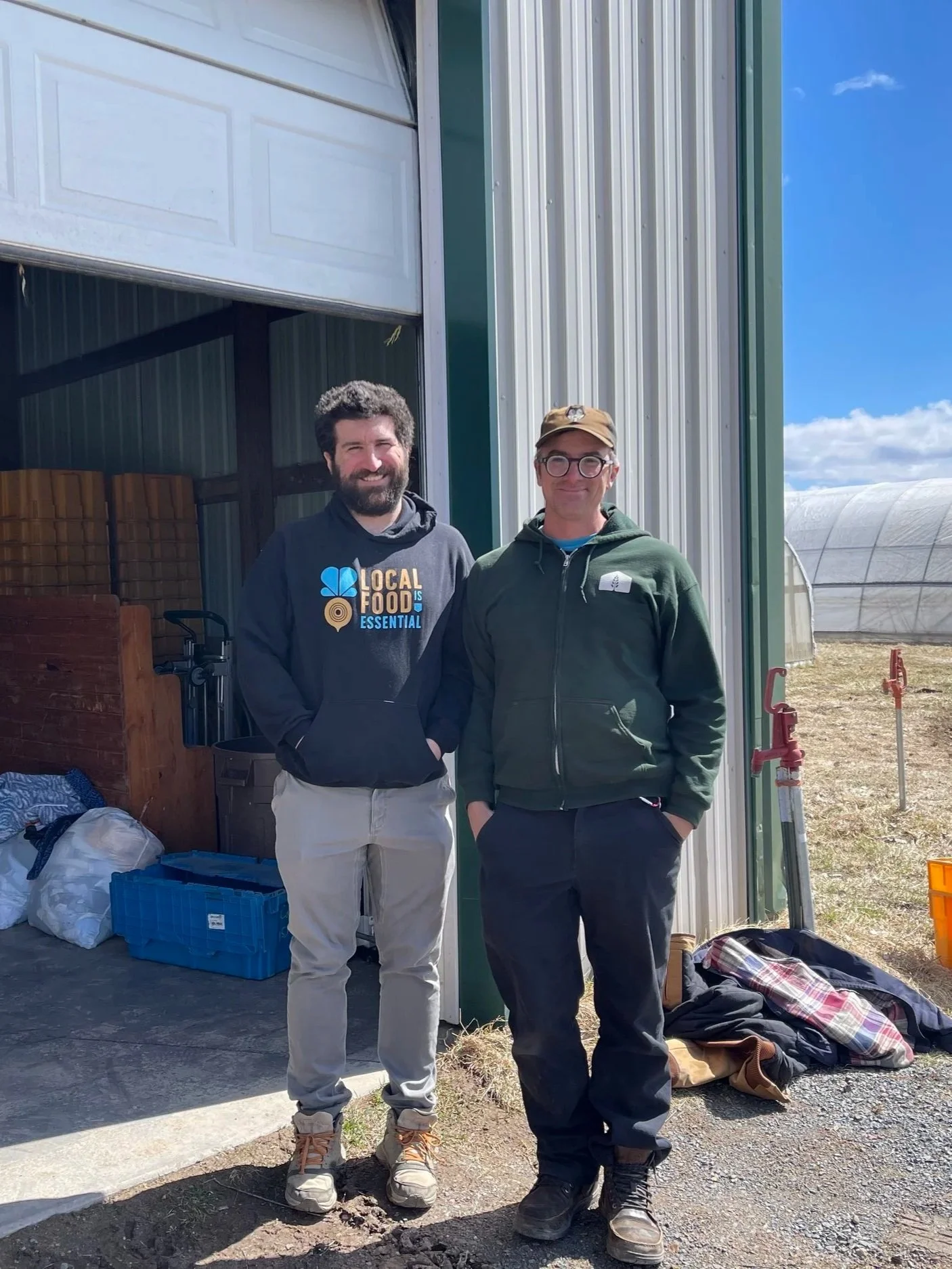 Ariel Pressman and Josh Bryceson working on the Farmer to Food Bank program